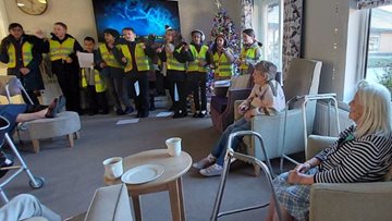 Local schoolchildren visit Burnley care home to sing Christmas carols